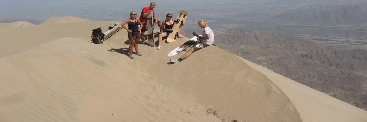 Sandboarding on the White hill in Ica in Nazca