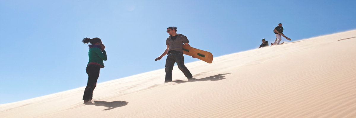Sandboarding on the White hill in Ica in Nazca